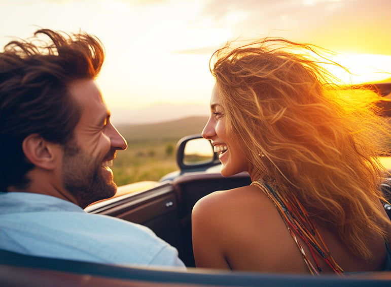 A young couple driving through wine country for wine weekend saving labels using Treasured Wine label removers